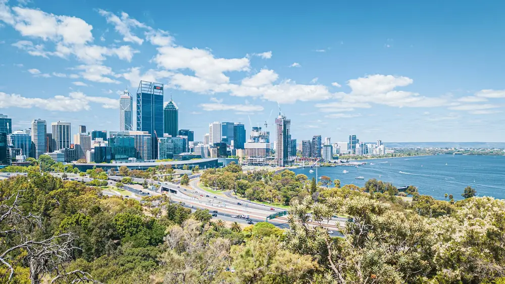 Perth skyline at sunset across the Swan River — destination for Kiwi movers