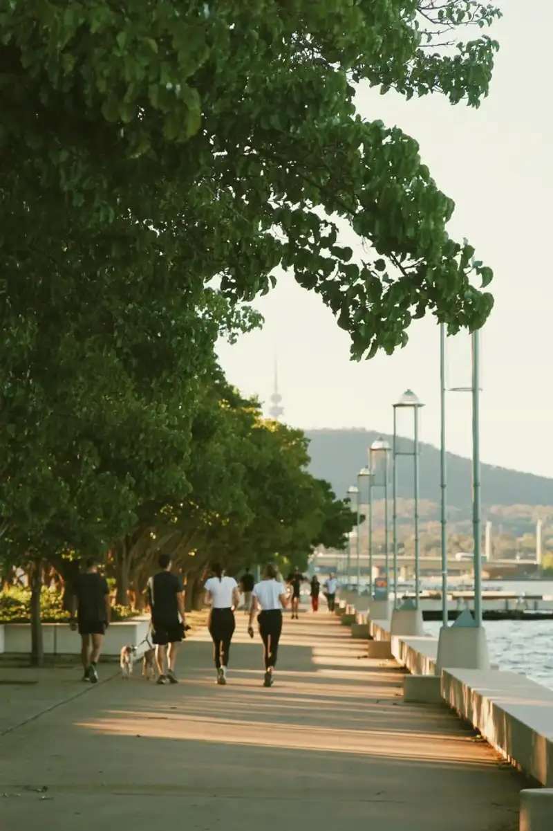 People walking by the lake in Canberra — Enjoying the outdoors and lifestyle after moving from NZ